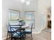 Cozy breakfast nook with bright windows and a modern table set for casual dining at 123 Evergreen Dr, Auburndale, FL 33823