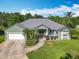 Well-maintained single-story home with a well-manicured lawn at 123 Evergreen Dr, Auburndale, FL 33823