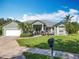 Charming single-story home with well-maintained lawn and curb appeal, featuring a mailbox at 123 Evergreen Dr, Auburndale, FL 33823
