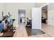 Interior view showcasing rooms connected by doorways and a glimpse of the kitchen and workout area at 123 Evergreen Dr, Auburndale, FL 33823