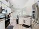 Spacious kitchen with stainless steel appliances and natural light at 123 Evergreen Dr, Auburndale, FL 33823