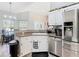 Open concept kitchen featuring stainless steel appliances at 123 Evergreen Dr, Auburndale, FL 33823