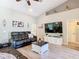 Comfortable living room with vaulted ceilings, a ceiling fan, and modern decor at 123 Evergreen Dr, Auburndale, FL 33823