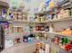 Organized walk-in pantry featuring wire shelving, ample storage for food and household items at 123 Evergreen Dr, Auburndale, FL 33823