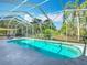 Inviting screened-in pool area offers a relaxing retreat with ample space for lounging and outdoor enjoyment at 123 Evergreen Dr, Auburndale, FL 33823