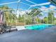 Inviting screened-in pool area offers a relaxing retreat with ample space for lounging at 123 Evergreen Dr, Auburndale, FL 33823