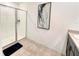 Modern bathroom with glass-enclosed shower and contemporary finishes at 1363 Benevento Dr, Winter Haven, FL 33884