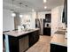 Spacious kitchen with an island, stainless steel appliances, and ample counter space at 1363 Benevento Dr, Winter Haven, FL 33884