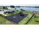 Community playground by the lake with swings, slide, and lake view at 1363 Benevento Dr, Winter Haven, FL 33884