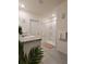 Well-lit bathroom features a vanity, walk-in shower, and modern finishes at 1378 Fox Squirrel Dr, Davenport, FL 33897