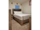 Bedroom with upholstered headboard and soft, neutral carpeting at 1378 Fox Squirrel Dr, Davenport, FL 33897