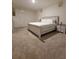 Bright bedroom with carpet flooring, a large bed, and modern furnishings at 1378 Fox Squirrel Dr, Davenport, FL 33897
