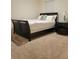 Bedroom featuring a modern bed frame, soft carpet, and a calming ambiance at 1378 Fox Squirrel Dr, Davenport, FL 33897