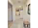 Bright foyer with tile flooring, leading to an open-concept living area and staircase at 1378 Fox Squirrel Dr, Davenport, FL 33897
