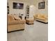 Comfortable living room features tile flooring, modern decor, and neutral tones for a relaxing atmosphere at 1378 Fox Squirrel Dr, Davenport, FL 33897