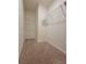 Empty walk-in closet with shelving and carpet flooring, offering ample storage space at 1378 Fox Squirrel Dr, Davenport, FL 33897