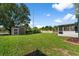 Expansive backyard with a storage shed and plenty of space at 1800 Emily Dr, Winter Haven, FL 33884