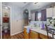 Bathroom featuring vanity, integrated sink, tile accents, and natural light at 1800 Emily Dr, Winter Haven, FL 33884