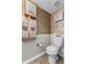 Bathroom featuring toilet and tile flooring, decorative walls, and recessed lighting at 1800 Emily Dr, Winter Haven, FL 33884