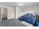 Cozy bedroom features carpeted floors, closet and access to other rooms at 1800 Emily Dr, Winter Haven, FL 33884