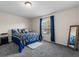 Bedroom features natural light from the window, a ceiling fan and carpet floors at 1800 Emily Dr, Winter Haven, FL 33884