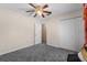 Bedroom features carpeted floors, closet and access to other rooms and hall at 1800 Emily Dr, Winter Haven, FL 33884