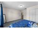 Bedroom features carpeted floors, closet and access to other rooms and hall at 1800 Emily Dr, Winter Haven, FL 33884