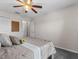 Comfortable bedroom featuring neutral walls and carpeting, a ceiling fan, and closet at 1800 Emily Dr, Winter Haven, FL 33884