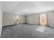 Large carpeted bedroom with abundant natural light streaming through the windows at 1800 Emily Dr, Winter Haven, FL 33884
