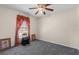 Bedroom featuring natural light from the window, a ceiling fan and carpet floors at 1800 Emily Dr, Winter Haven, FL 33884