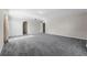 Spacious carpeted bedroom featuring abundant natural light and closet space at 1800 Emily Dr, Winter Haven, FL 33884