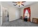 Bedroom features carpeted floors, closet and access to other rooms and hall at 1800 Emily Dr, Winter Haven, FL 33884