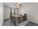 Bedroom features natural light from the window, a ceiling fan and carpet floors at 1800 Emily Dr, Winter Haven, FL 33884