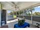 Enclosed lanai with a ceiling fan and view of the backyard at 1800 Emily Dr, Winter Haven, FL 33884