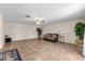 Living room view with tile flooring, ceiling fan, and open kitchen and island at 1800 Emily Dr, Winter Haven, FL 33884