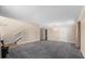 Large living room featuring plush gray carpet and staircase to the second floor at 1800 Emily Dr, Winter Haven, FL 33884