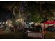 Cozy backyard featuring string lights, garden features, and outdoor structures at 195 E Vine St, Bartow, FL 33830