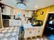 Bright kitchen with white cabinetry, stainless steel appliances, and decorative chandelier at 195 E Vine St, Bartow, FL 33830