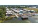 Aerial view featuring a community pool, boat dock, and lake access at 2202 Starboard, Winter Haven, FL 33881