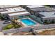 Aerial view of community pool, patio furniture, and proximity to lake access at 2202 Starboard, Winter Haven, FL 33881