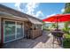 Inviting backyard patio featuring a tiki bar, comfortable seating, and a well-maintained brick surface at 2202 Starboard, Winter Haven, FL 33881