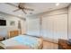 Bright bedroom with light floors, ceiling fan, coastal decor, and ample closet space at 2202 Starboard, Winter Haven, FL 33881