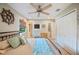 Bedroom with wood floors and double closets featuring seaside decor at 2202 Starboard, Winter Haven, FL 33881