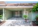 Carport view showcasing ample parking, exterior door, and decorative details at 2202 Starboard, Winter Haven, FL 33881