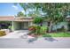 Exterior view of home featuring mature trees and colorful flowerbeds highlighting its curb appeal at 2202 Starboard, Winter Haven, FL 33881