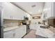 Modern kitchen with white cabinets, stainless steel appliances, and ample counter space at 2202 Starboard, Winter Haven, FL 33881