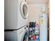 Laundry room with stacked washer and dryer and shelving for storage at 2202 Starboard, Winter Haven, FL 33881