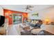 Cozy living room featuring comfortable sofas, modern decor, and access to the outdoor patio at 2202 Starboard, Winter Haven, FL 33881