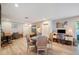 Open living room with ample space, light-colored walls, wood floors and decor at 2202 Starboard, Winter Haven, FL 33881