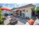 Outdoor patio area with firepit, tropical landscaping, and bar at 2202 Starboard, Winter Haven, FL 33881